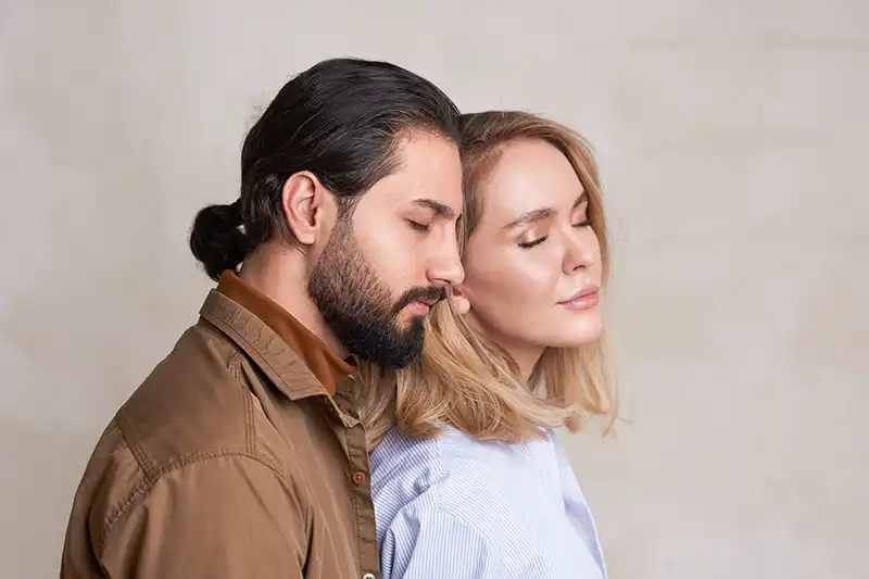 Close up of couple looking away, dealing with the emotions of infertility