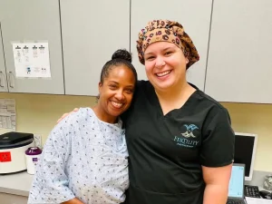 Patient and fertility clinic team member sharing a supportive moment at Fertility Partnership in St. Louis